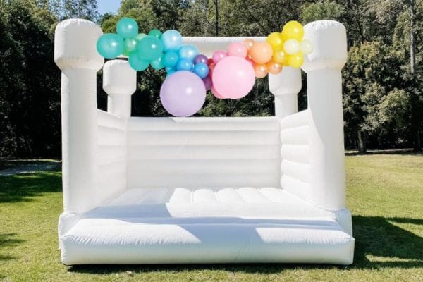 A white jumping castle at a wedding