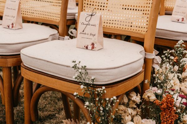 A wedding aisle seat with a gift
