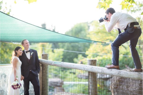 A photographer up high taking a downward shot of the wedding couple