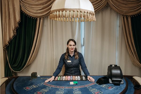 A croupier at a cards table