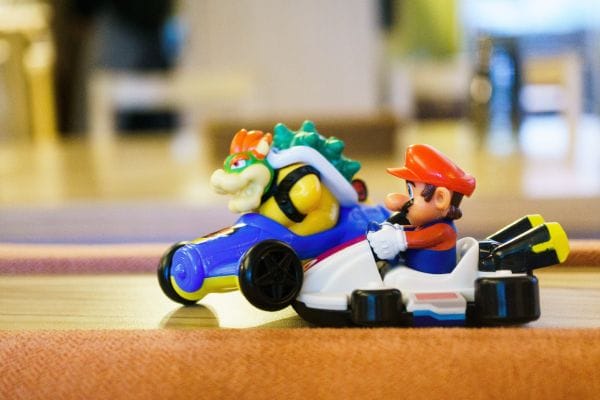 Mario and Bowser figurines in karts